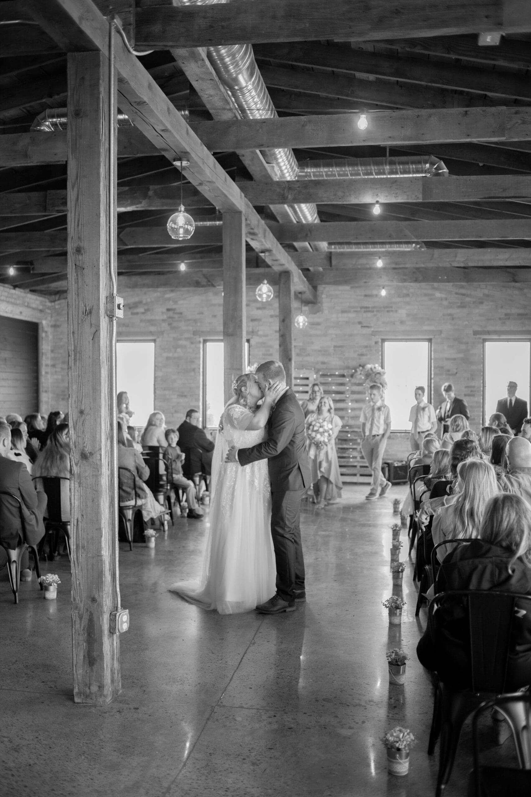 bride and groom first kiss - simple rigby idaho wedding