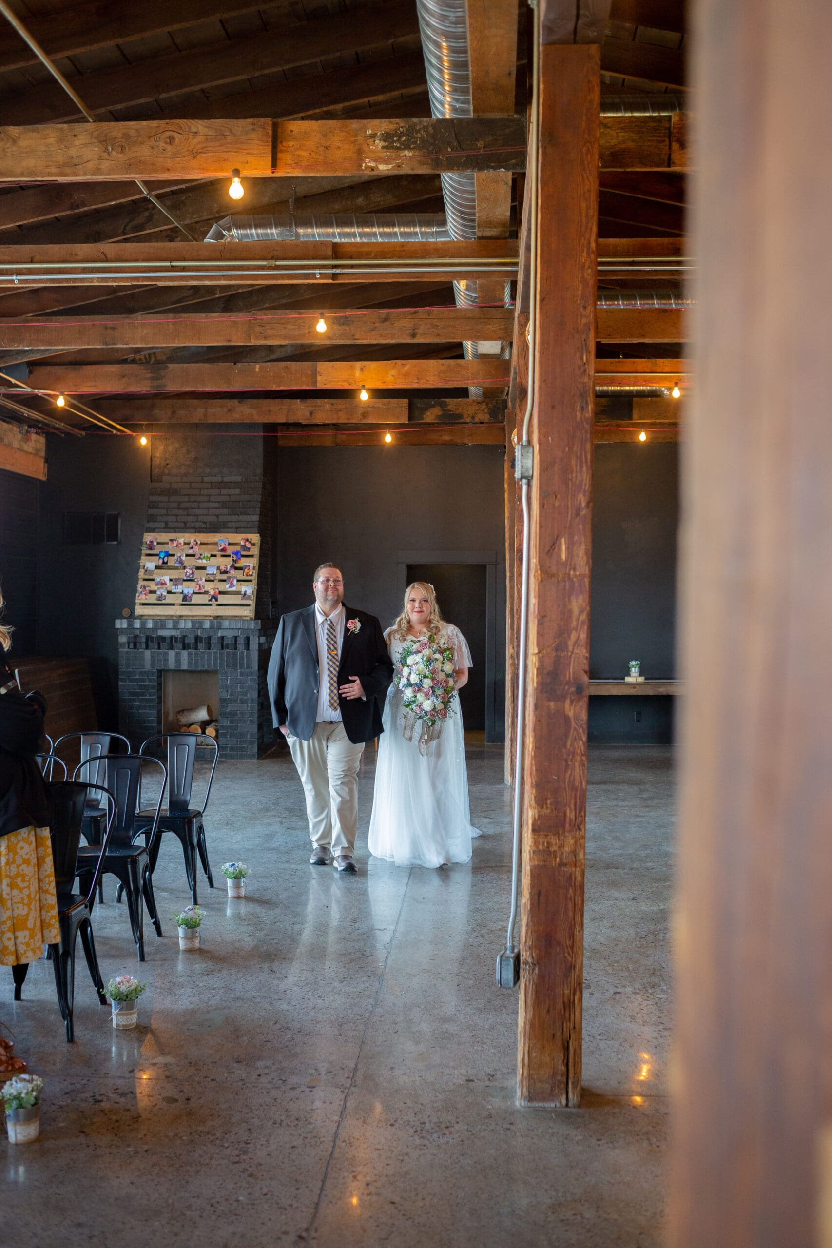 bride walking down the aisle with her dad - simple rigby Idaho wedding