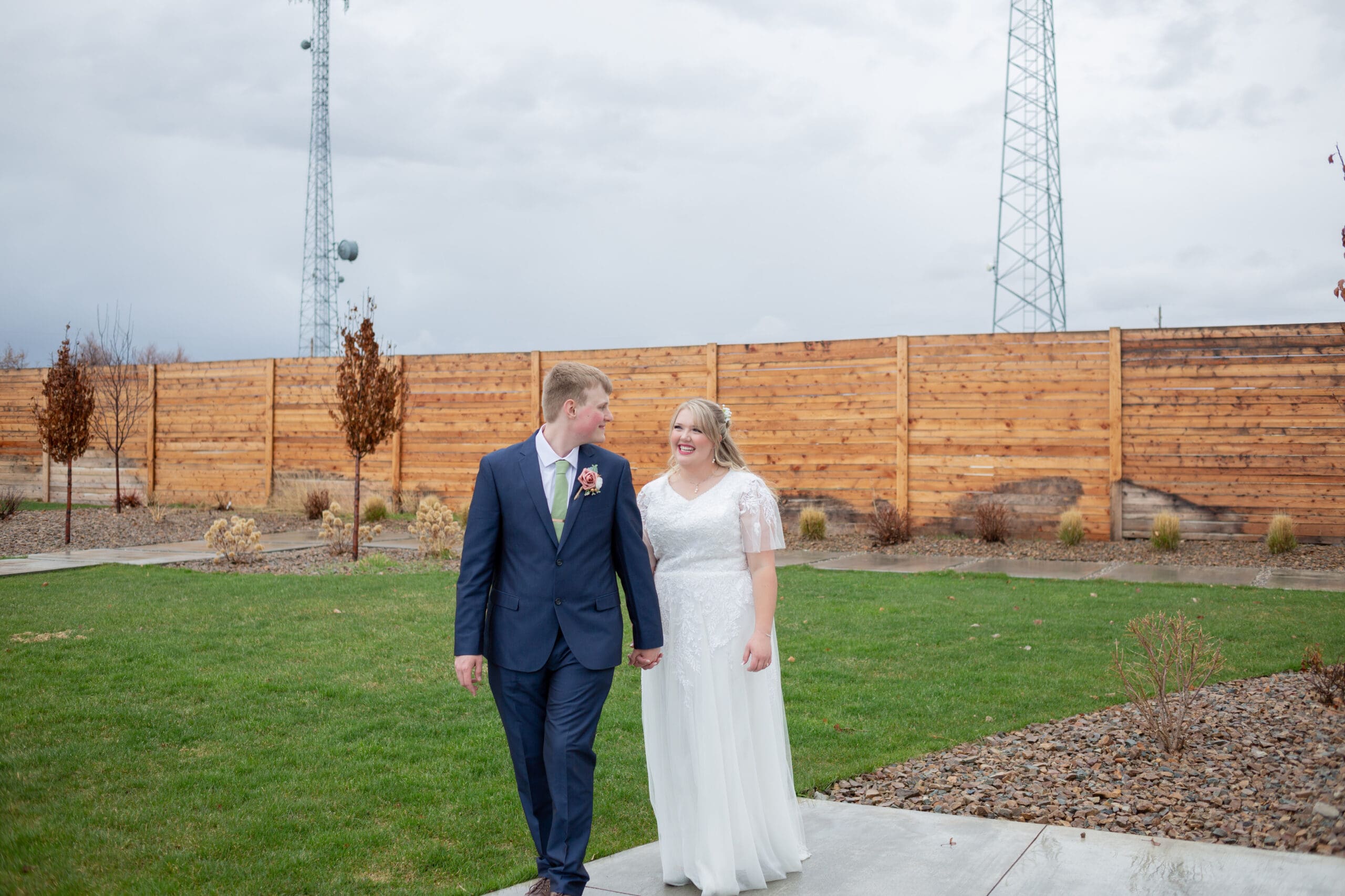 groom leading bride by the hand walking