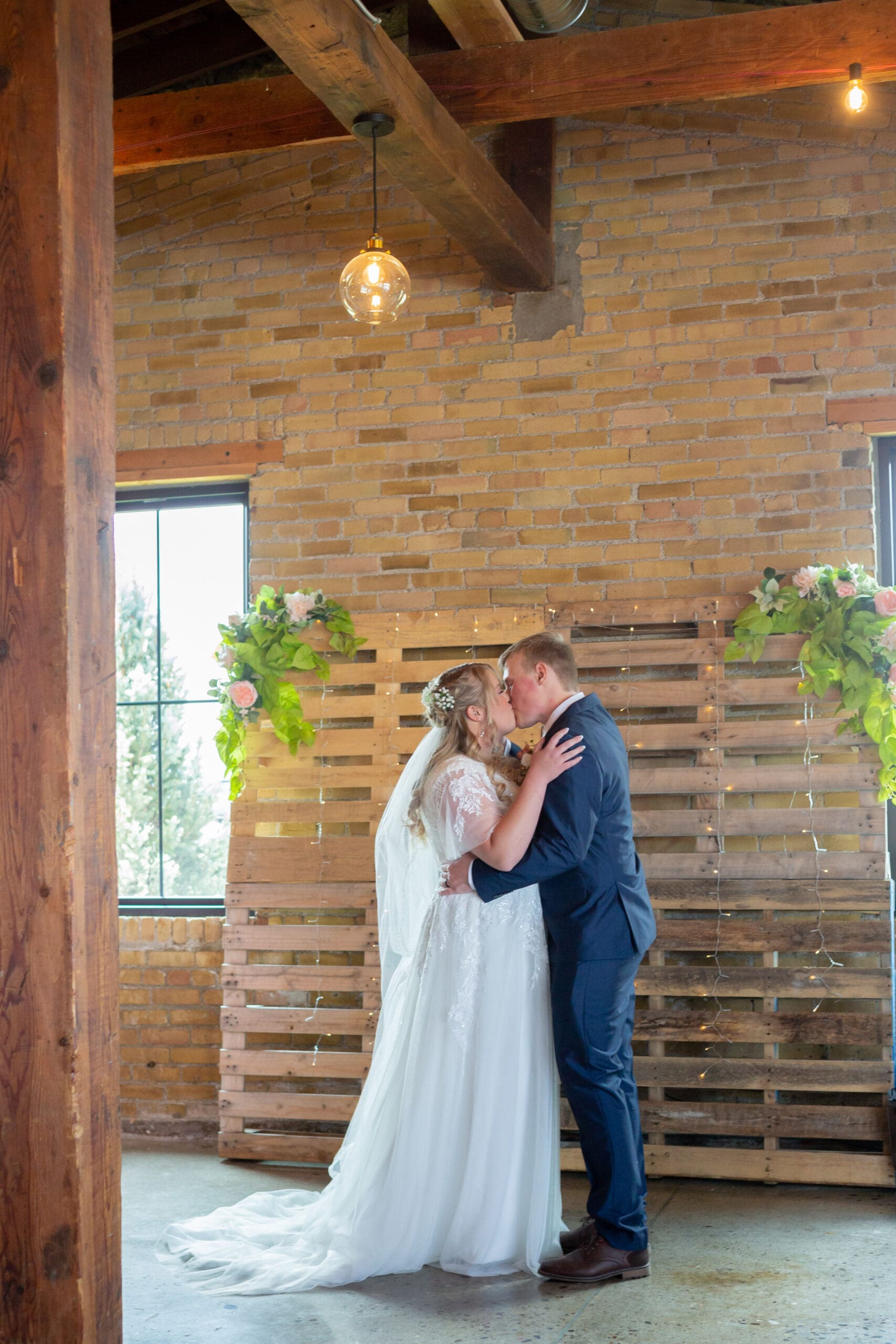 bride and groom first kiss - simple rigby idaho wedding