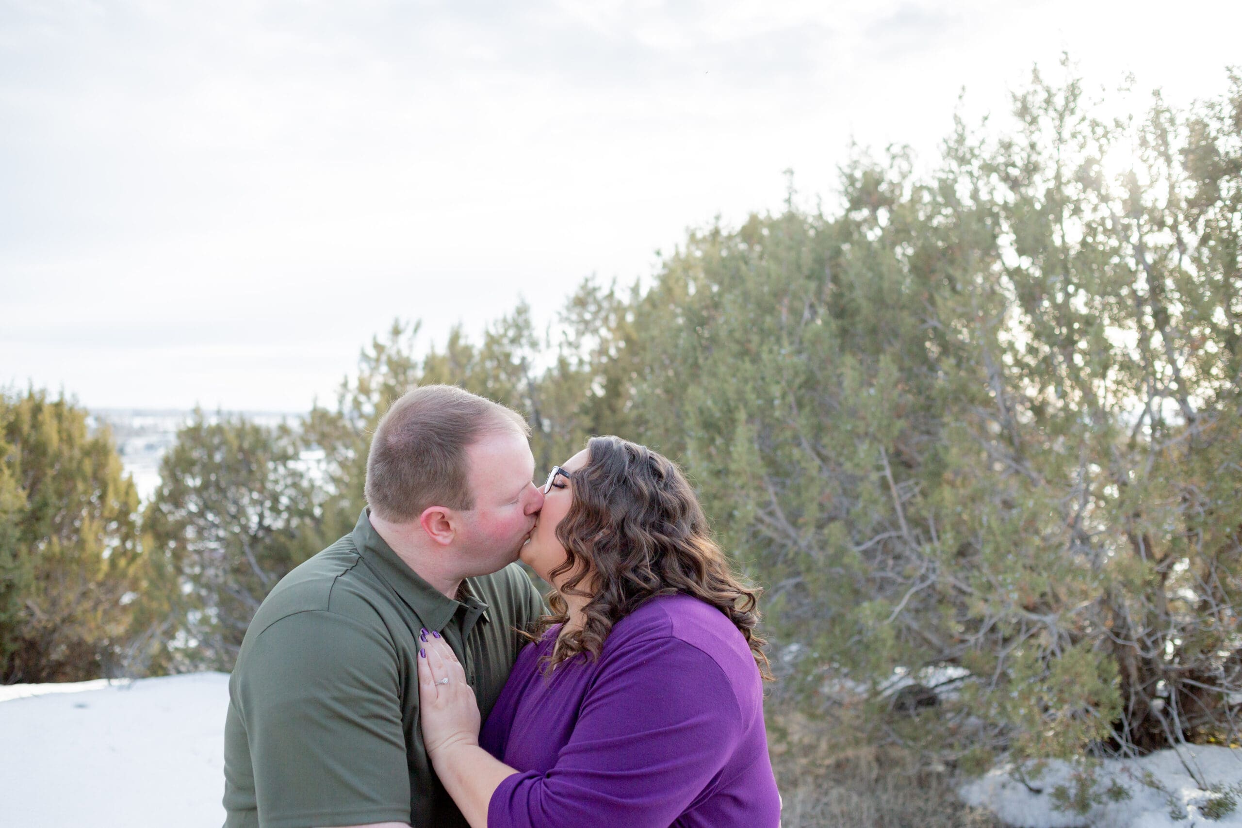 engaged-couple-kissing