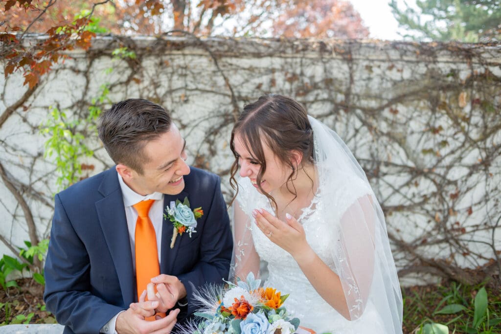 bride-and-groom-sitting-and-laughing
