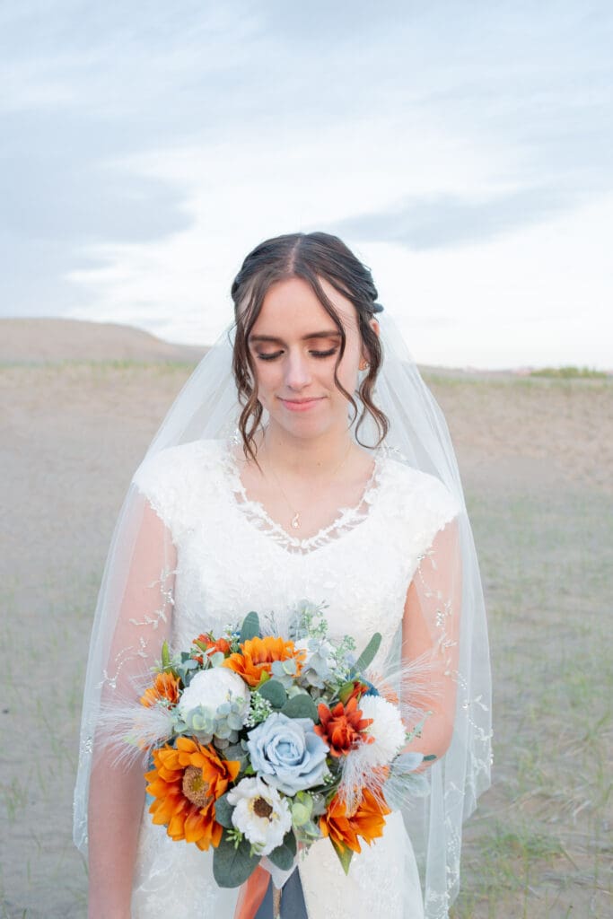 idaho-bride-looking-down-at-bouquet