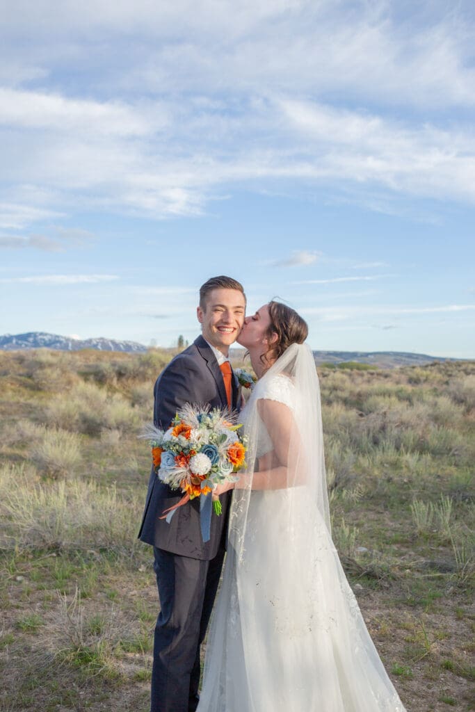sarah-tapp-couple-bride-kissing-groom-on-cheek