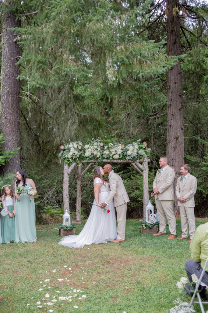 Seattle Wedding Photographer captures Seattle Wedding Ceremony first kiss of inter-racial couple