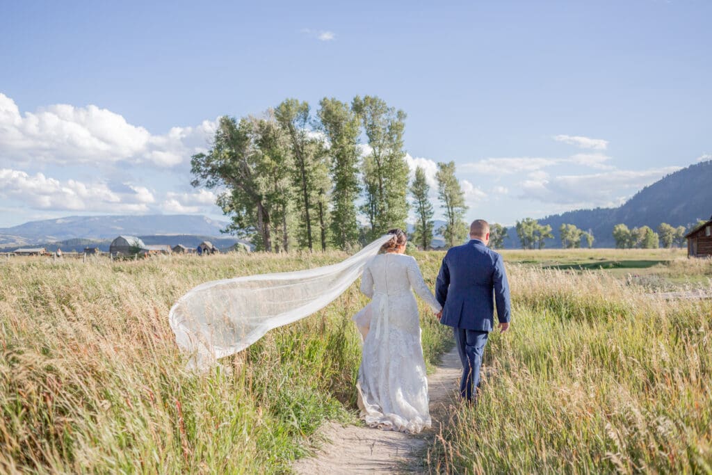 PNW Elopement Photographer captures bride and groom walking away together after PNW elopement