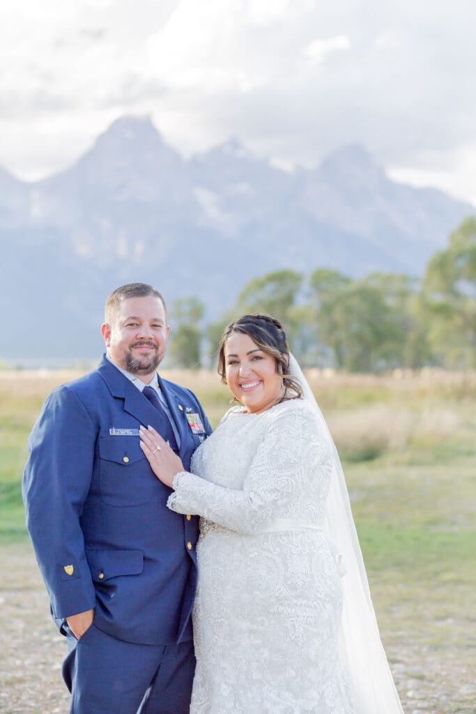 PNW Elopement Photographer captures bride and groom embracing while bride places hand on groom's chest