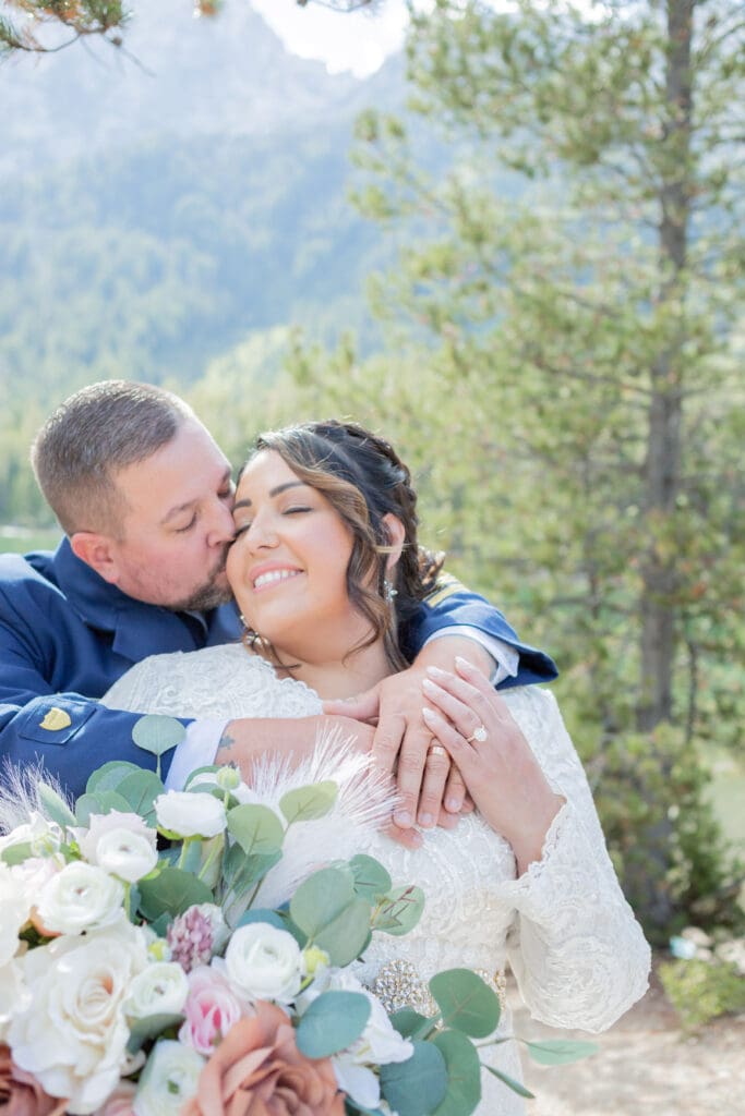 PNW Elopement Photographer captures groom kissing bride's cheek