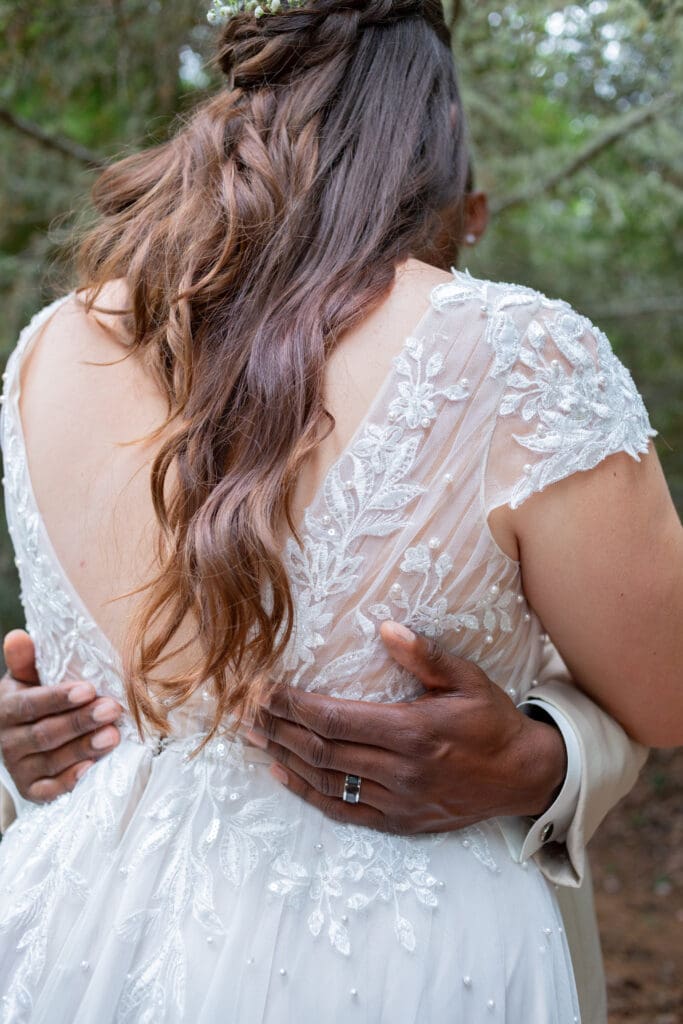 PNW Elopement Photographer captures man holding bride's waist during bridal portraits
