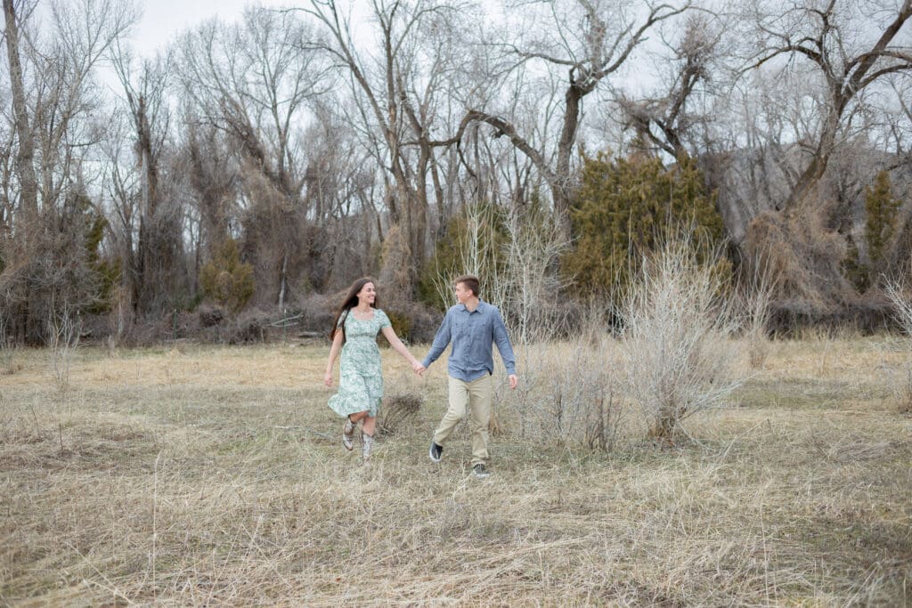 couple-running-in-a-meadow