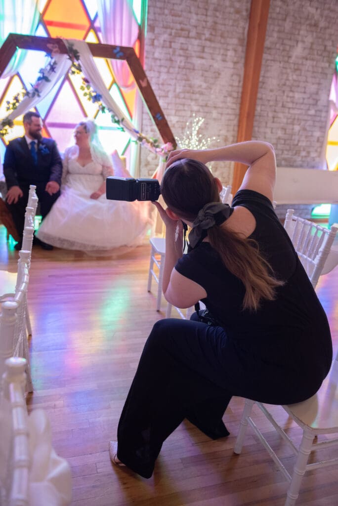 behind-the-scenes-photographer-taking-photo-of-bride-and-groom