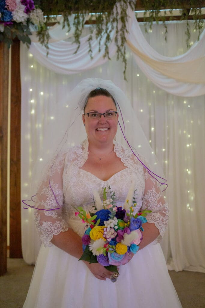 bride-looking-at-camera-holding-bouquet