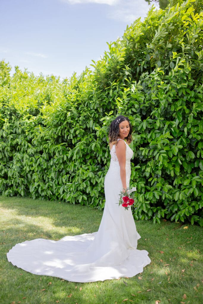 PNW Elopement Photographer captures bride wearing wedding dress and holding bouquet