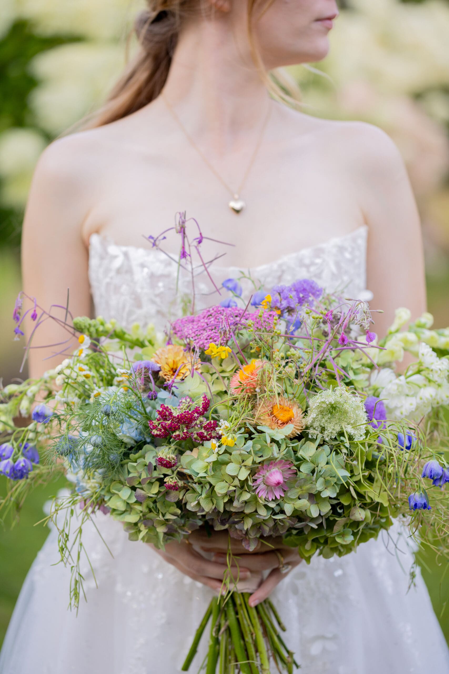 bride-holding-wildflower-bouquet